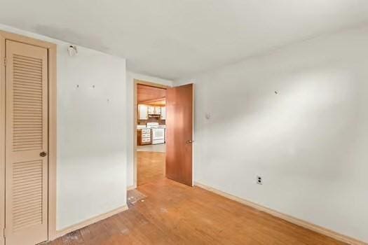 10 Sandpiper Ter, Wareham, MA 02571 - unfurnished bedroom with baseboards, wood finished floors, and a closet
