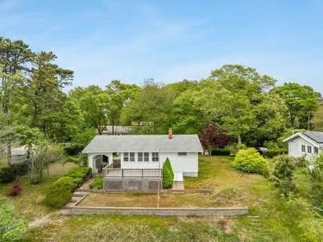 10 Sandpiper Ter, Wareham, MA 02571 - back of house featuring a wooden deck and a chimney