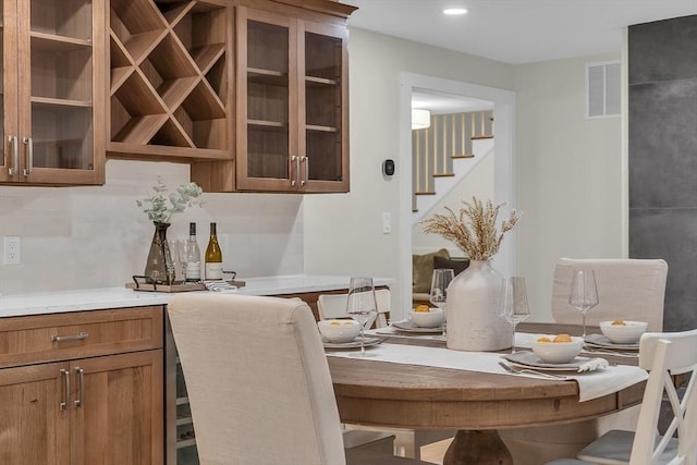 dining area featuring indoor bar