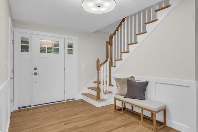 foyer entrance with light wood-type flooring