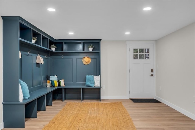 mudroom with light hardwood / wood-style floors