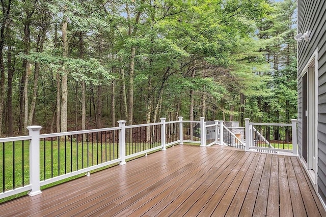 wooden terrace with a yard