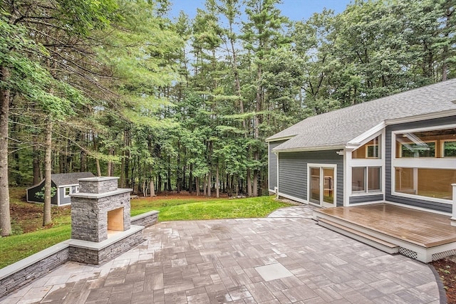 view of patio / terrace with an outdoor stone fireplace