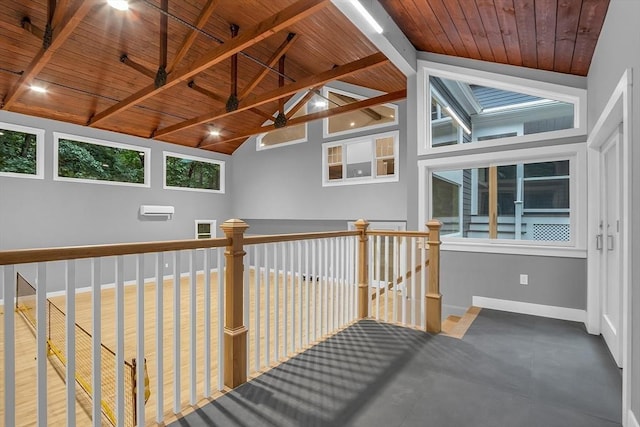 hall featuring vaulted ceiling with beams and wood ceiling