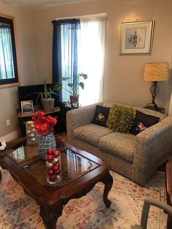 81 Bellevue Ave, Haverhill, MA 01832 - living room featuring baseboards and wood finished floors