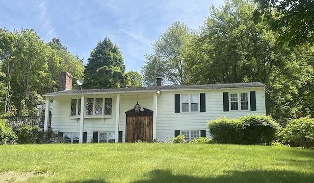 189 Scantic Rd, Hampden, MA 01036 - split foyer home with a chimney and a front yard