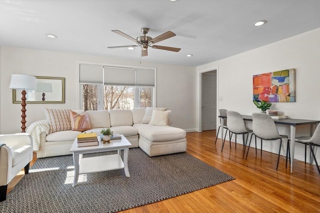 living area with recessed lighting, baseboards, ceiling fan, and wood finished floors