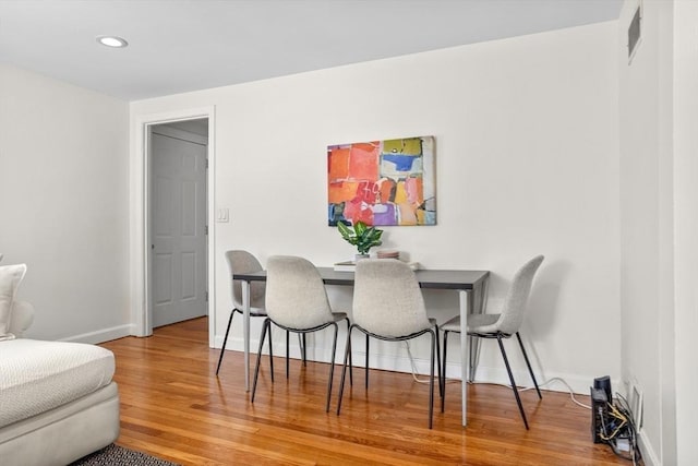 dining area featuring recessed lighting, visible vents, baseboards, and wood finished floors