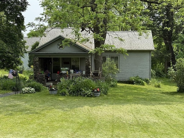 36 Railroad St, Amherst, MA 01002 - back of property with covered porch and a lawn