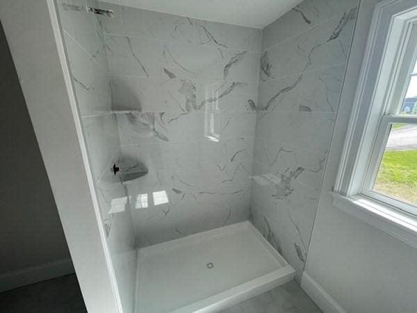 bathroom featuring walk in shower