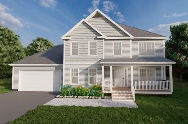 view of front of home featuring covered porch, a garage, and a front yard