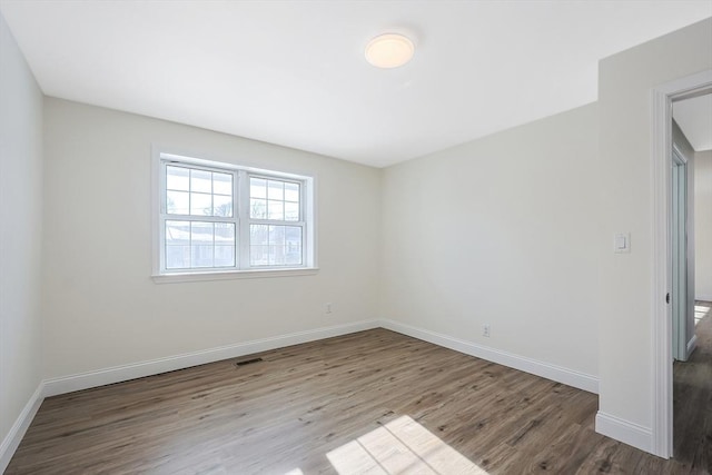 spare room featuring light hardwood / wood-style flooring