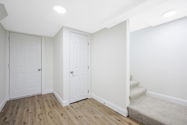 basement featuring light hardwood / wood-style floors