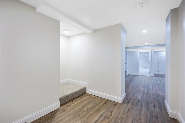 hallway with wood-type flooring