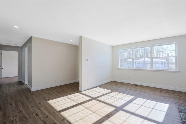 empty room featuring hardwood / wood-style floors