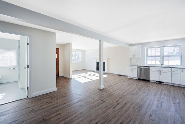 basement featuring sink and wood-type flooring