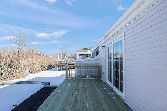 view of snow covered deck