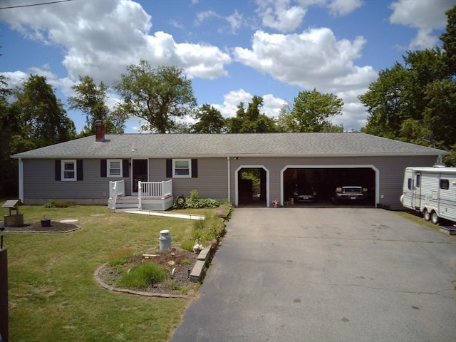 625 Middleboro Ave, Taunton, MA 02718 - single story home featuring an attached garage, driveway, a front yard, and a chimney