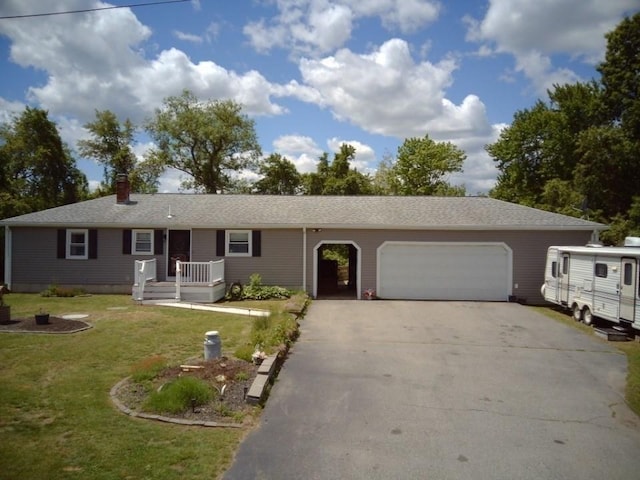625 Middleboro Ave, Taunton, MA 02718 - ranch-style home with an attached garage, driveway, a front yard, and a chimney