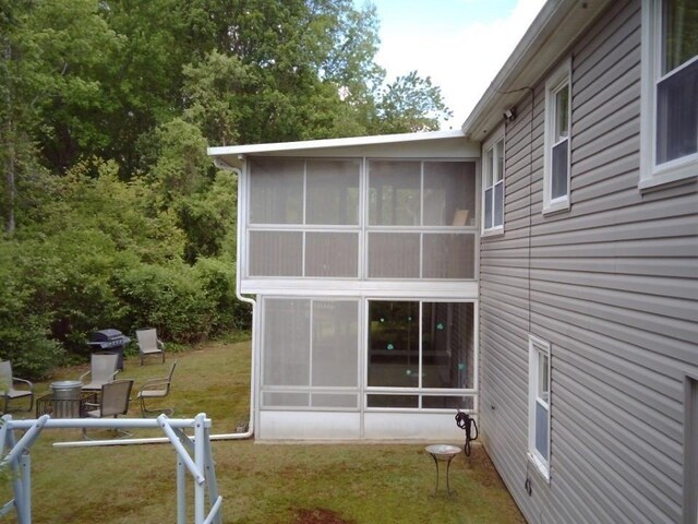 625 Middleboro Ave, Taunton, MA 02718 - view of home's exterior with a sunroom and a yard
