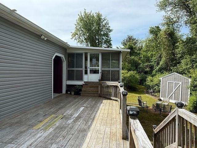 625 Middleboro Ave, Taunton, MA 02718 - deck featuring a sunroom and a lawn