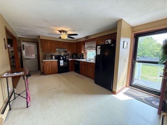 625 Middleboro Ave, Taunton, MA 02718 - kitchen with black appliances, light countertops, a ceiling fan, brown cabinetry, and a sink