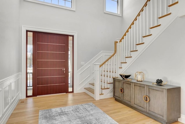 entryway with light hardwood / wood-style flooring