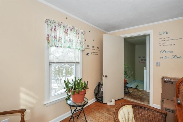 interior space featuring hardwood / wood-style floors and crown molding