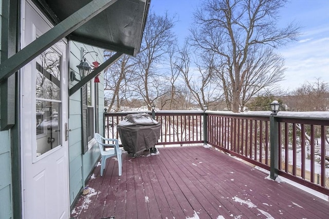 snow covered deck with grilling area