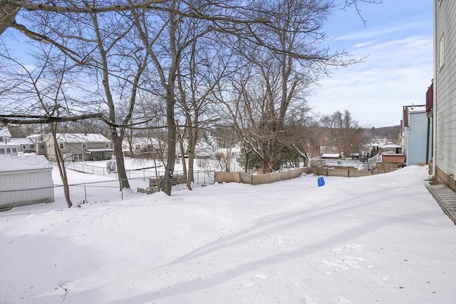 view of yard layered in snow