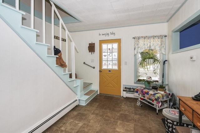 foyer entrance featuring baseboard heating