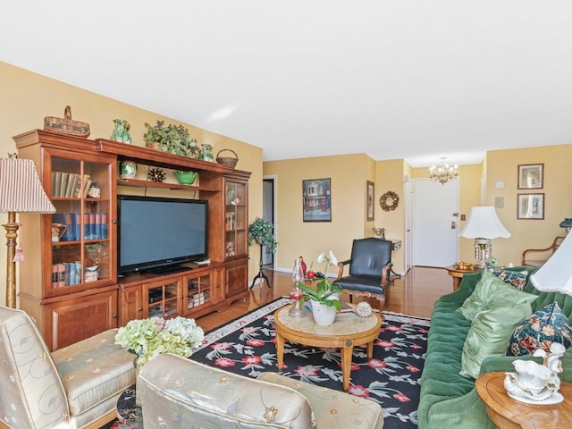 living room featuring a chandelier and hardwood / wood-style flooring