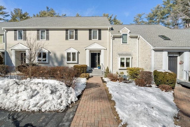 view of front of property featuring roof with shingles