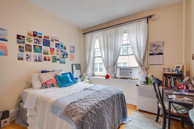 60 Dwight Unit 2, Brookline, MA 02446 - bedroom featuring wood finished floors and cooling unit