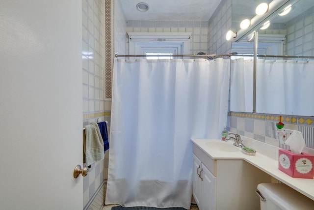 60 Dwight Unit 2, Brookline, MA 02446 - full bathroom featuring vanity, curtained shower, and toilet