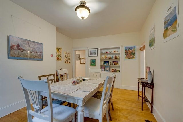60 Dwight Unit 2, Brookline, MA 02446 - dining area featuring light wood-type flooring and baseboards