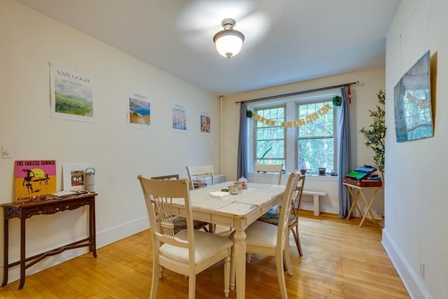 60 Dwight Unit 2, Brookline, MA 02446 - dining space featuring light wood-style flooring and baseboards