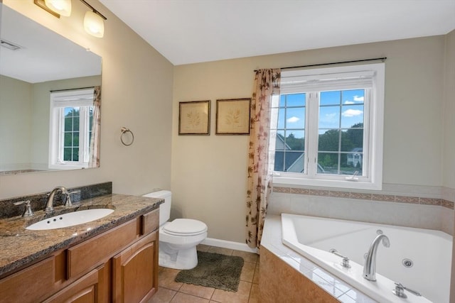 full bathroom with a jetted tub, vanity, toilet, tile patterned floors, and baseboards