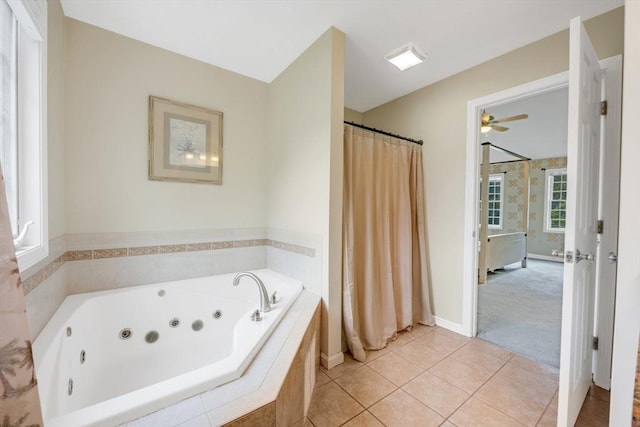 bathroom featuring a whirlpool tub, ceiling fan, tile patterned floors, and baseboards