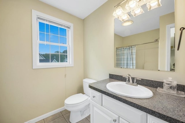 bathroom featuring tile patterned flooring, toilet, vanity, a shower with curtain, and baseboards