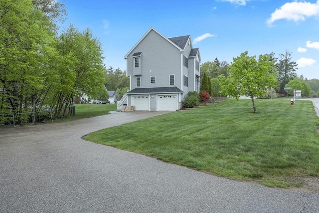 view of property exterior featuring an attached garage, concrete driveway, and a lawn