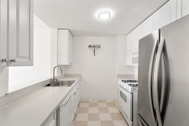 519 Harrison Ave Unit D117, Boston, MA 02118 - kitchen featuring white appliances, light floors, light countertops, and white cabinetry