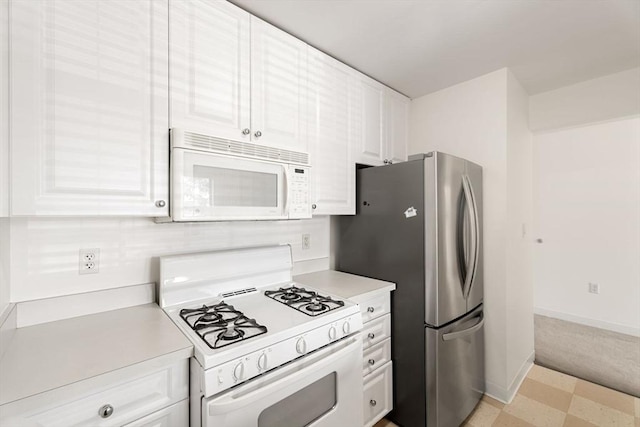 519 Harrison Ave Unit D117, Boston, MA 02118 - kitchen featuring white appliances, light countertops, and white cabinets