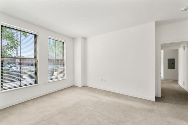 519 Harrison Ave Unit D117, Boston, MA 02118 - unfurnished room featuring electric panel, light colored carpet, and plenty of natural light