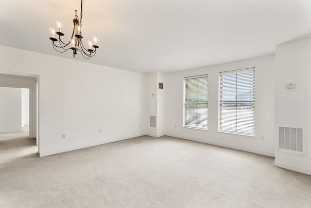 519 Harrison Ave Unit D117, Boston, MA 02118 - spare room featuring light carpet and a chandelier