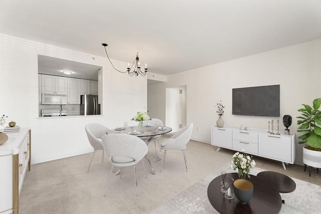 519 Harrison Ave Unit D117, Boston, MA 02118 - dining area featuring a chandelier