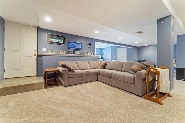 carpeted living room featuring visible vents and recessed lighting