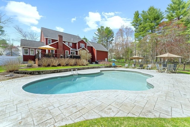 view of swimming pool with fence, a patio area, and a fenced in pool