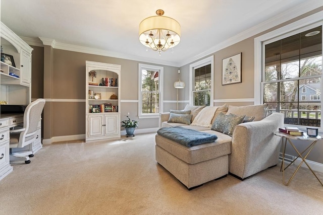 living room featuring baseboards, an inviting chandelier, crown molding, and light colored carpet