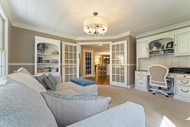 office with ornamental molding, light colored carpet, an inviting chandelier, and french doors